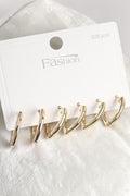 VORA HOUSE altın rengi pirinç üçgen küpe seti, 925 ayar gümüş çivili, şık ve minimalist tasarım.