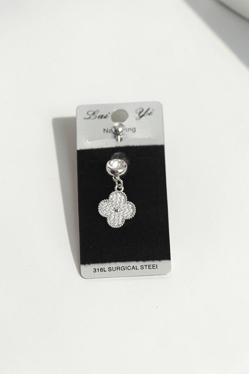 VORA HOUSE silver 316L surgical steel belly button piercing featuring a dangling clover charm with zircon stones.