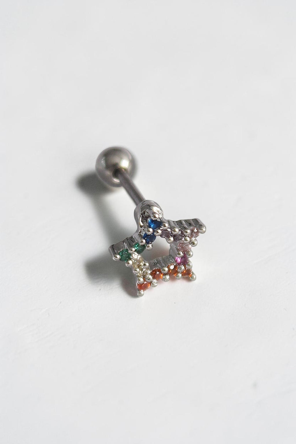 VORA HOUSE gümüş renkli, paslanmaz çelik, renkli zirkon taşlı yıldız figürlü tragus piercing