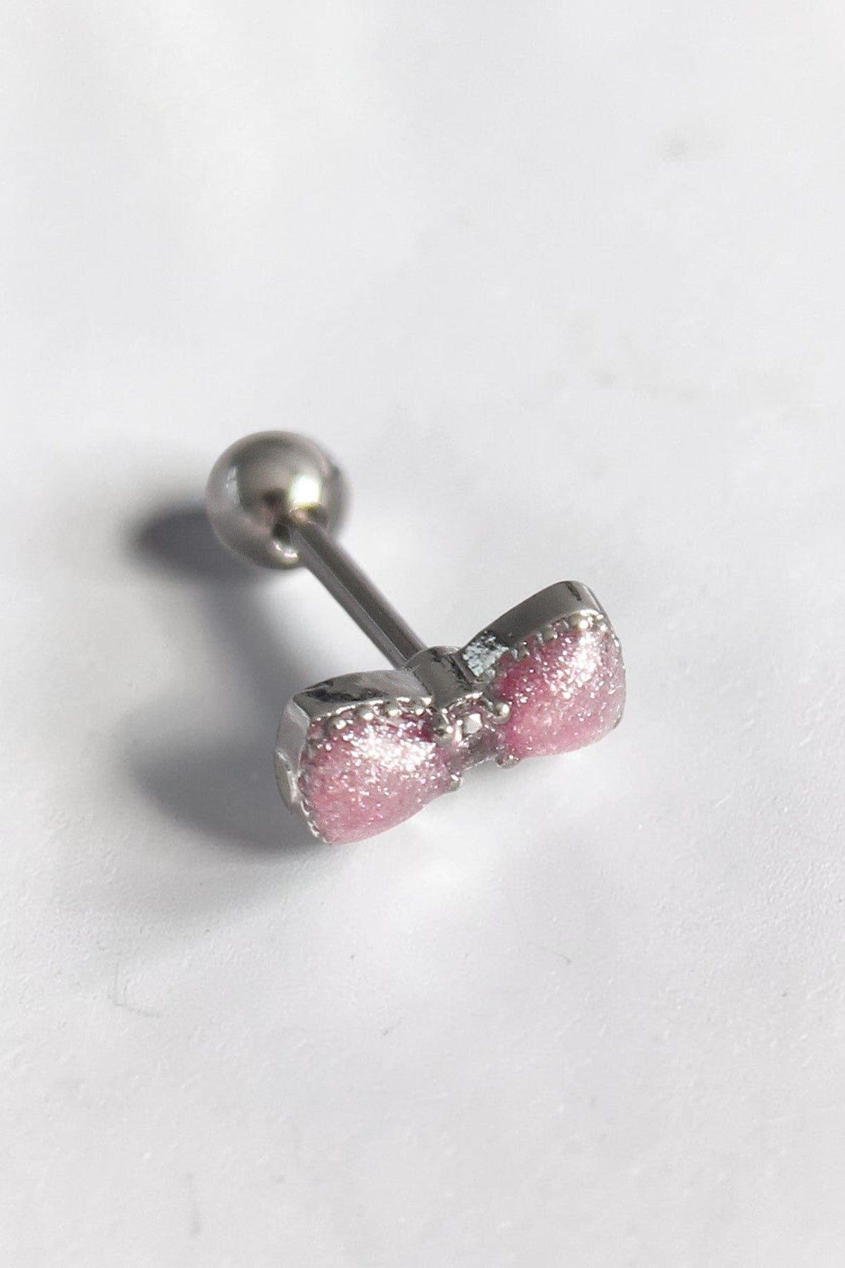 VORA HOUSE gümüş renkli, pembe kurdele figürlü ve zirkon taş detaylı paslanmaz çelik tragus piercing