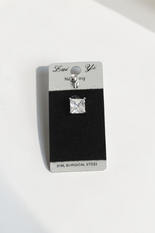 VORA HOUSE square zircon stone belly piercing made of 316L surgical steel on a display card