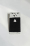 VORA HOUSE 316L surgical steel belly button piercing featuring a sparkling flower design with clear zircon stones.